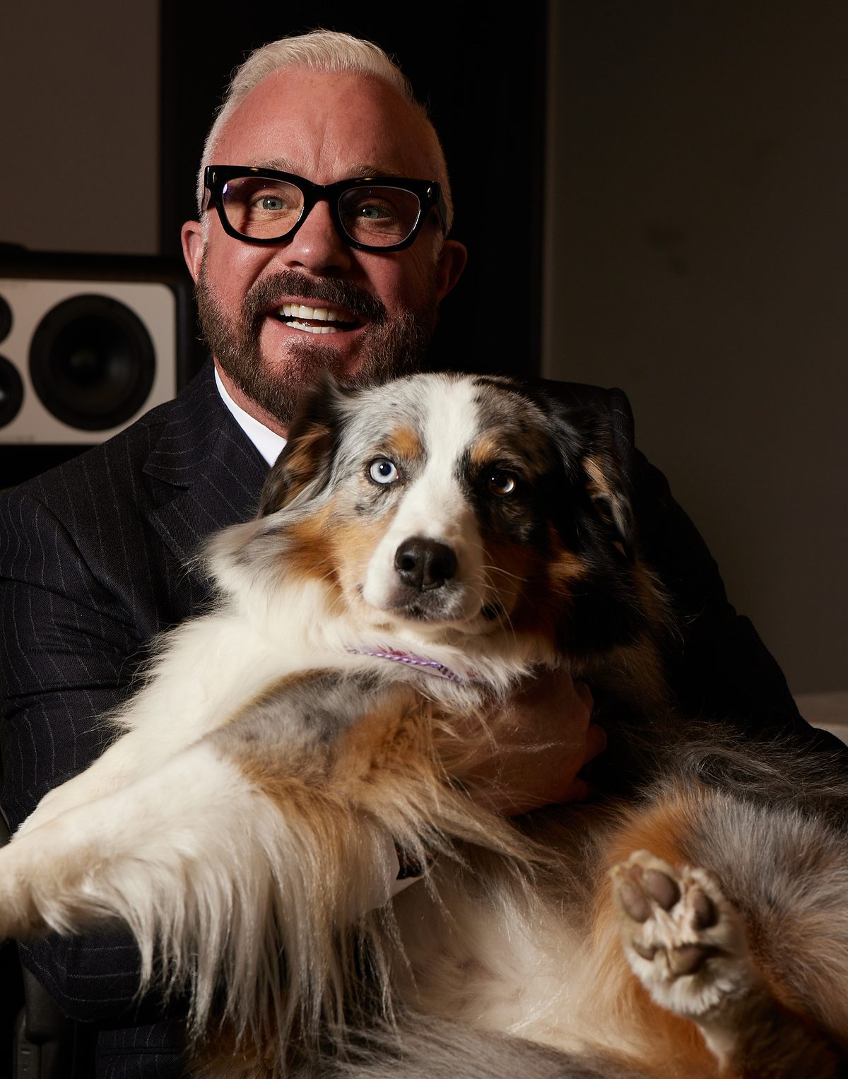 John Feldmann in his studio with his dog